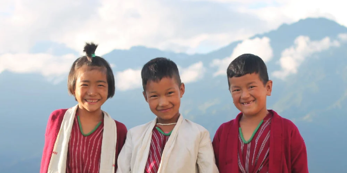 three children on a mountainside